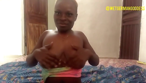 Sexy and horny black MILF shows off her tits in a solo video