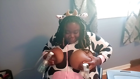 Ebony woman with big tits fucks her pussy on webcam