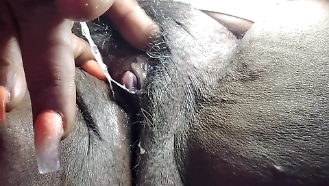 Horny black mature female gives a solo video with her pussy