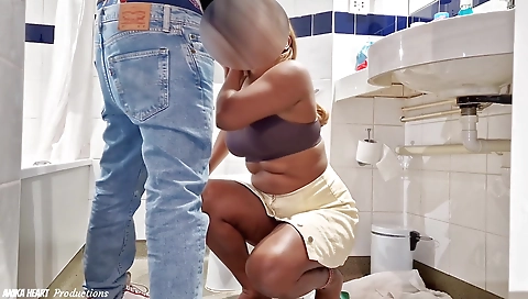 Hot blondie seduces a big black dude in a hotel bathroom