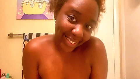 Ebony girl with big boobs shows off her tits and pussy