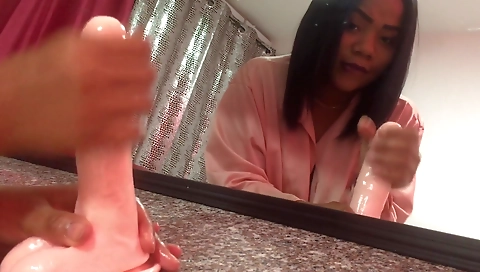 Ebony beauty with a sexy face rubs her clit with a toy