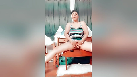 Ebony beauty with a shaved pussy is masturbating on webcam