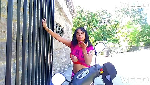 Busty black ebony woman with big tits has fun outdoors