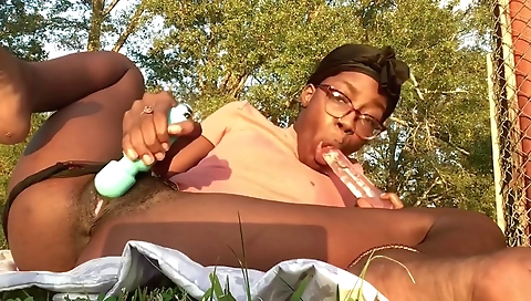 Ebony milf with a hairy bush is smoking and masturbating