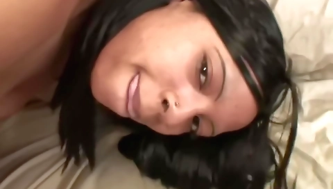 Black teen in a black dress gives a blowjob to a big cock