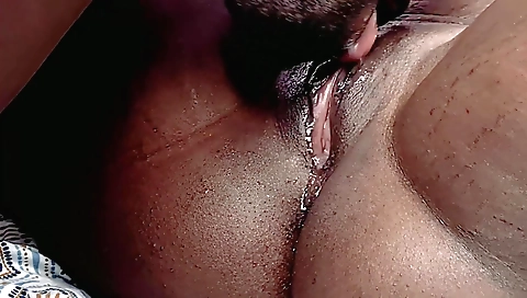 A black woman fucks a black and white man in close up