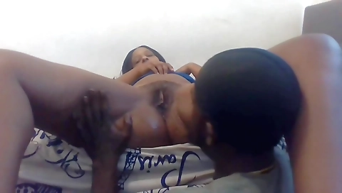 Ebony brunette girl taking a selfie in front of the webcam