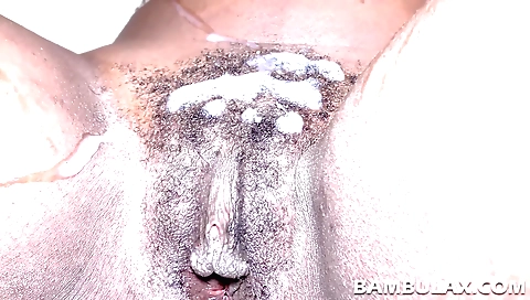 Ebony couple with hairy pussy get on the bed and cum on it