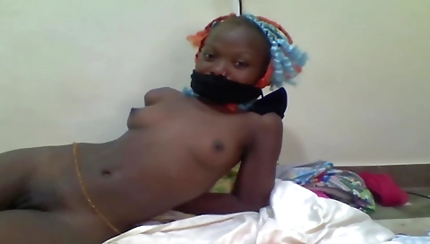 Ebony slut is tied up in her bed in the webcams video